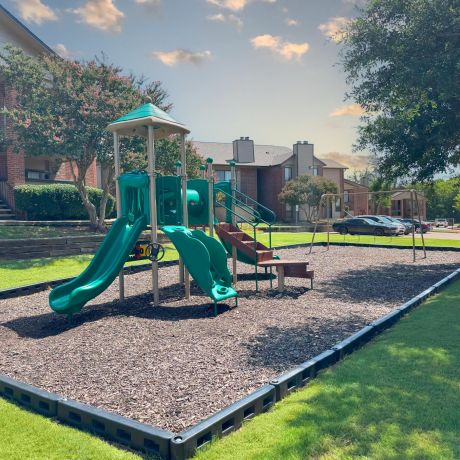 Valley Creek playground with a green slide.